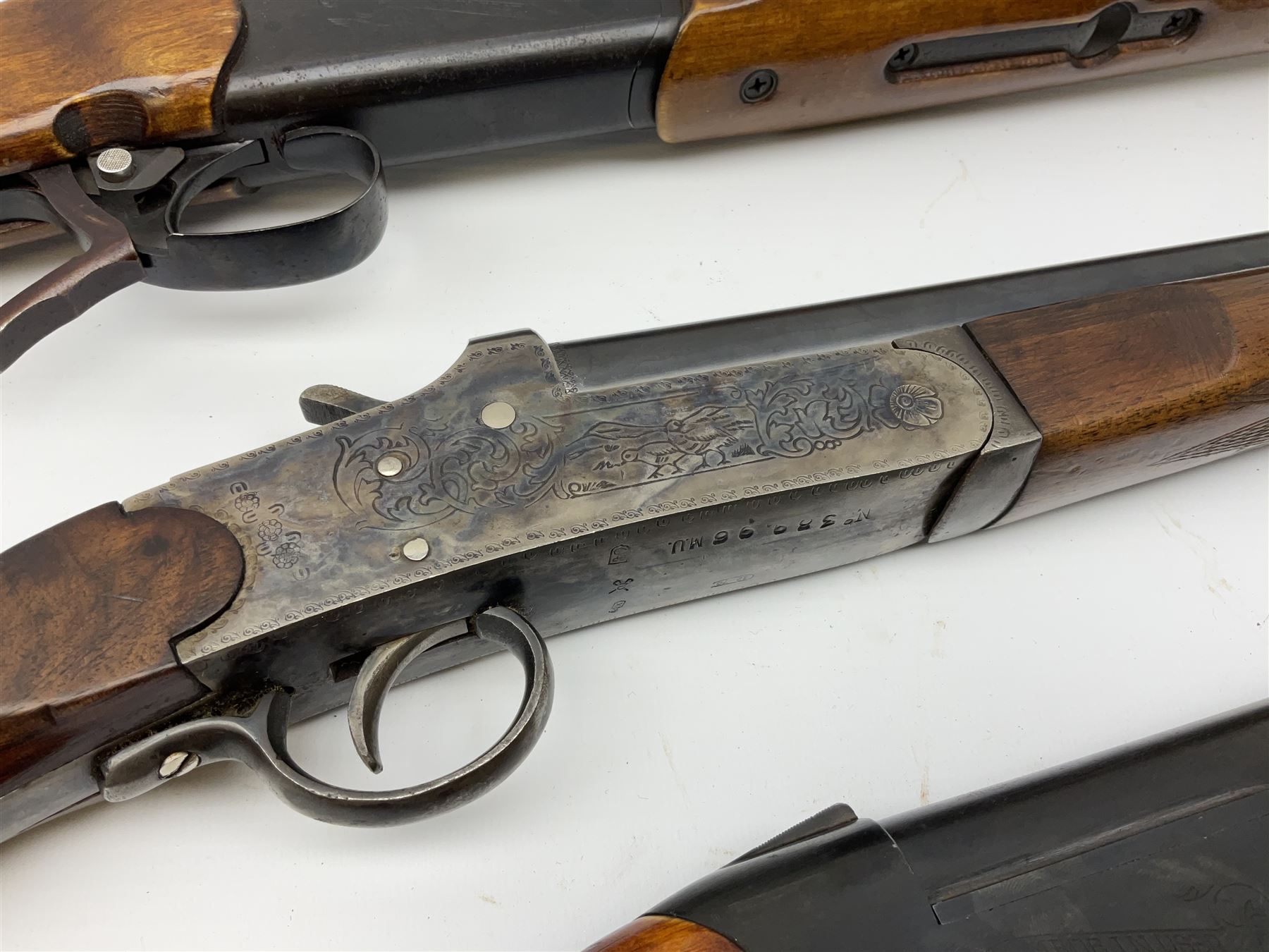 Three 12-bore single barrel sporting guns - Russian Baikal with 72.5cm barrel and underlever opening, serial no.Y17440, L114cm overall; Russian Baikal with 72.5cm barrel and underlever opening, serial no.A23484 L114cm overall; and Spanish with 76.5cm barrel and top lever opening, serial no.38996MU L118.5cm overall (3) SHOTGUN CERTIFICATE REQUIRED