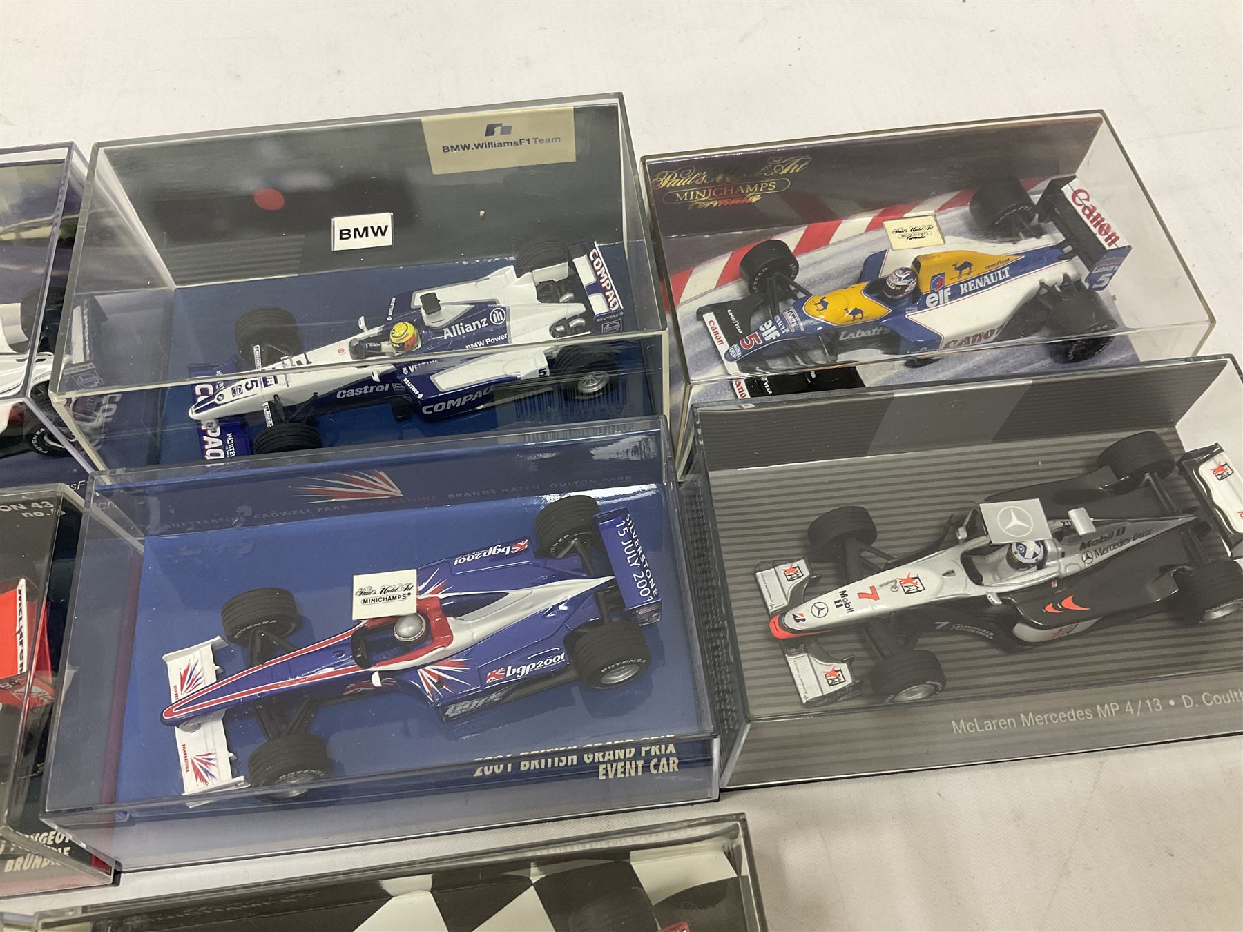 Pauls Model Art Minichamps Formula - ten 1:43 scale die-cast models of racing cars in plastic display cases (10)
