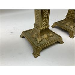 Pair of Victorian Gothic Revival brass candlesticks, in the Burges taste, with castellated tops, H21.5cm 