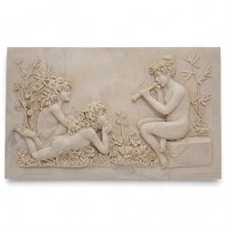 Composite plaque, depicting Sprites in a garden, with inset 'Arts and Commerce Promoted' medallion to reverse, 20cm x 33cm; together with a moulded glass Claret jug with silver plated mount H30cm 