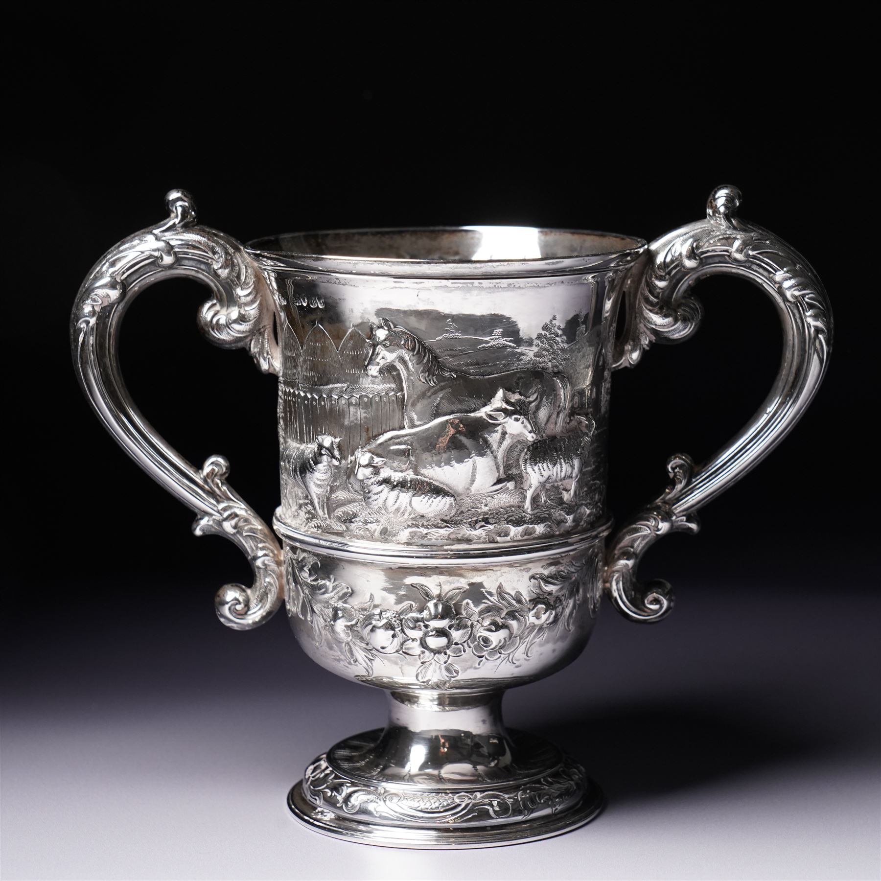 Victorian silver two handled cup embossed with cattle, horses and sheep and presented by Nottingham Mills Company to John Barugh, Thwing H16cm London 1865 Maker Henry Hollannd
