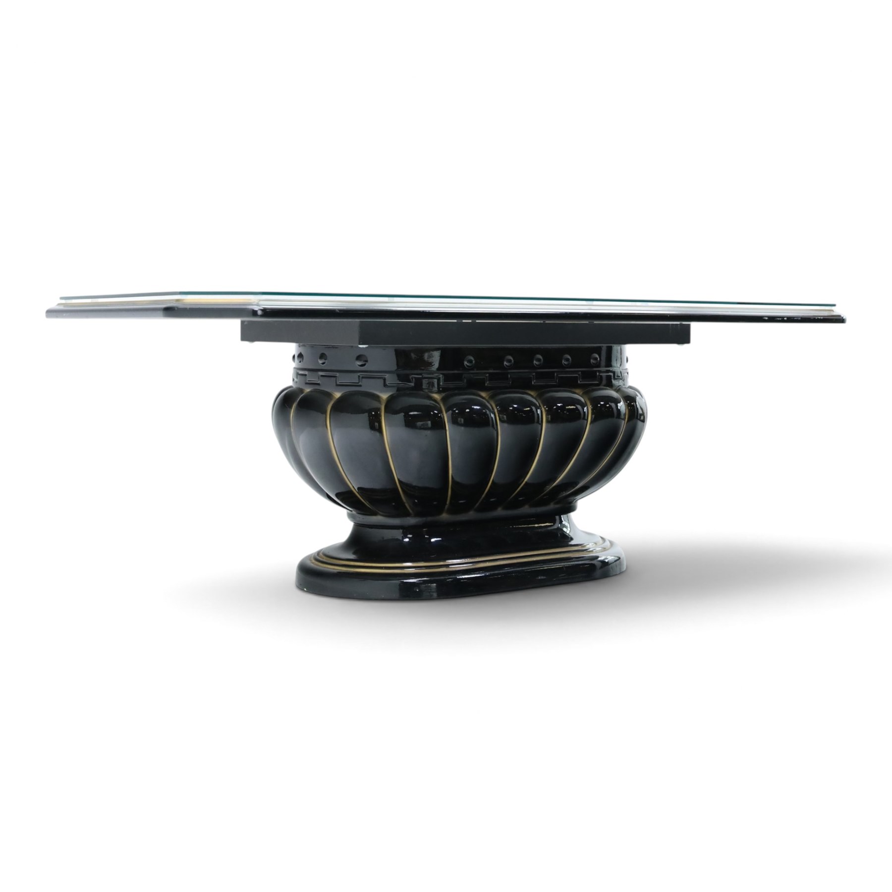 Italian Neoclassical inspired ebonised gloss coffee table, glazed cantered top with Greek key banding, on a shaped pedestal base with gilt highlights and stepped plinth 