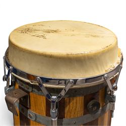 Three conga drums, comprising two Excelsior A. Salvadori Firenze stave-built wooden congas and one similar French example, with skin heads and metal tension mounts, on metal stands with hard carry cases for drums, tallest H79cm, D31cm