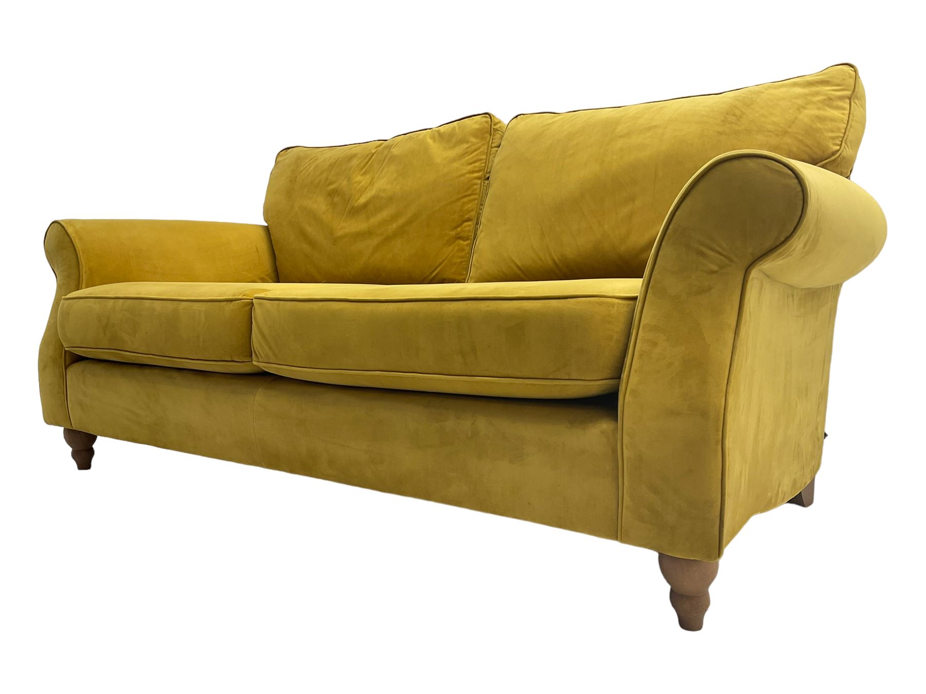 Next Furniture - traditional shaped three-seat sofa, upholstered in mustard velvet, rolled arms with pipping, on turned front feet