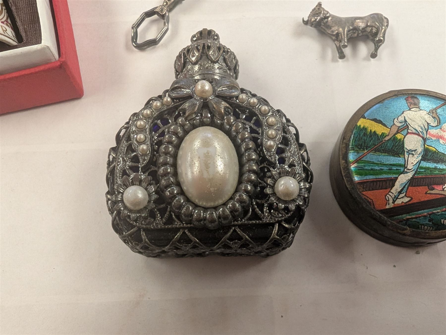 Faceted green glass scent bottle with brass cover, other scent bottles, pair of lorgnettes, Spode thimble, glass posy holder, etc 