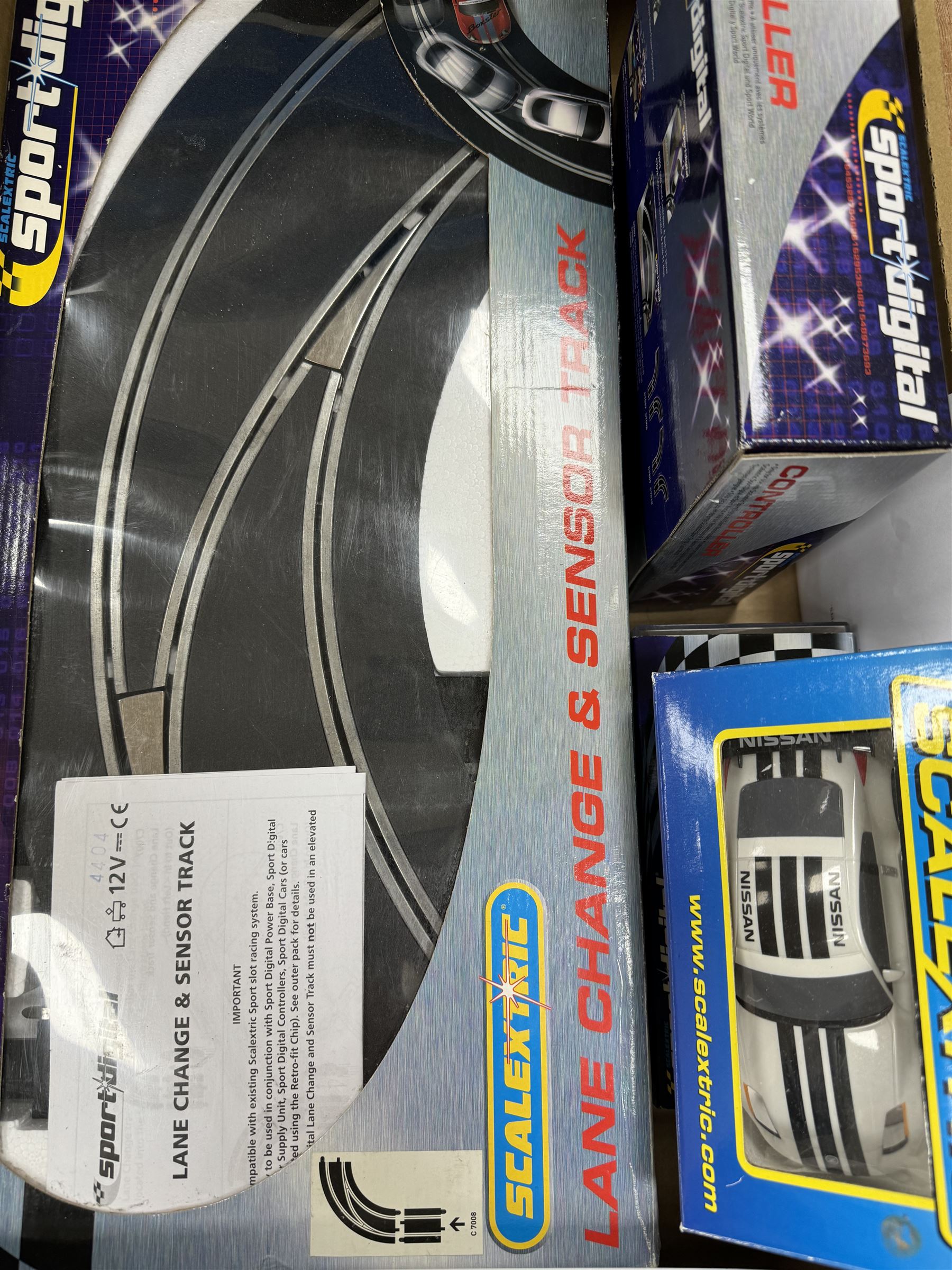 Quantity of Scalextric, including various sets; Digital Driver, Nissan Championship, Moto GP1, App Race control set and a collection of track and other accessories as per list