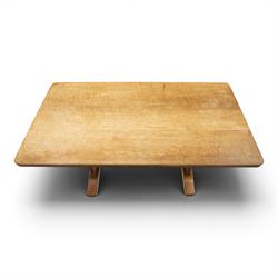 Acornman - 5' adzed oak dining table, rectangular top above a trestle base united by a stretcher with carved acorn signature, by the workshop of Alan Grainger of Brandsby
