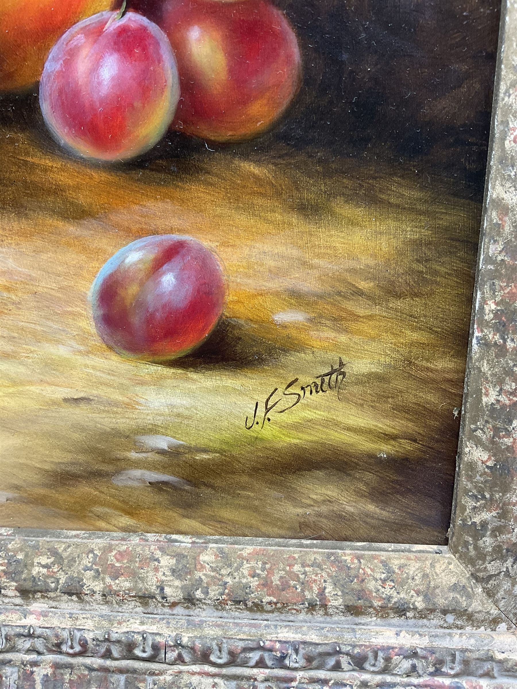 John F Smith (British 1934-): Still Life with Grapes and Peaches, oil on board signed 39cm x 29cm