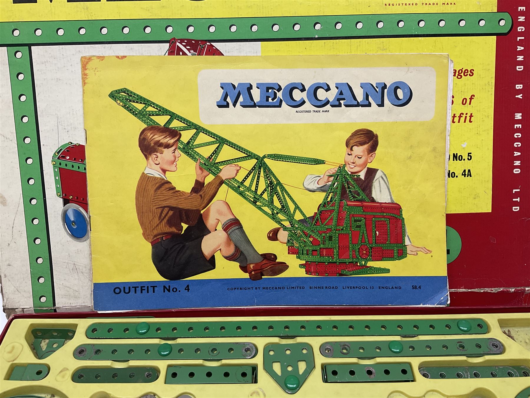 Meccano - Outfits 4, 6 & 7 with red and green parts; Outfits 4 & 6 virtually fully stocked and Outfit 7 containing large quantity of loose parts; Outfits 4 & 7 with instruction manuals; all boxed (3)