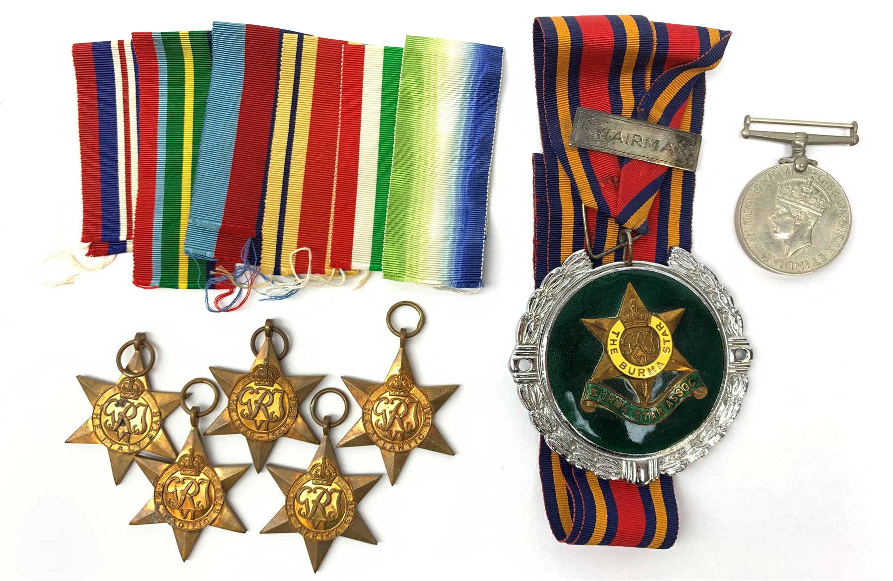  A group of WWII medals, comprising Pacific Star, Africa Star, Atlantic Star, Italy Star and The 1939-1945 Star, together with a War Medal 1939-1945, and Burma Star Association car badge.  
