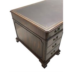 Large Georgian design mahogany twin pedestal partner's desk, moulded rectangular top with canted corners and inset leather writing surface, fitted with nine drawers and two cupboards, the pedestals with canted uprights decorated with blind fretwork, on ogee bracket feet