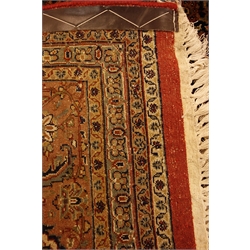  Persian Bijar style red ground rug carpet, repeating herati motif with blue medallion, repeating stylised border with guards, 337cm x 250cm  