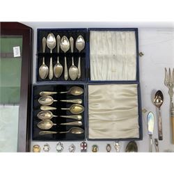 Group of silver plated and other teaspoons, to include a number of souvenir spoons, together with a wall mounted display cabinet, etc. 