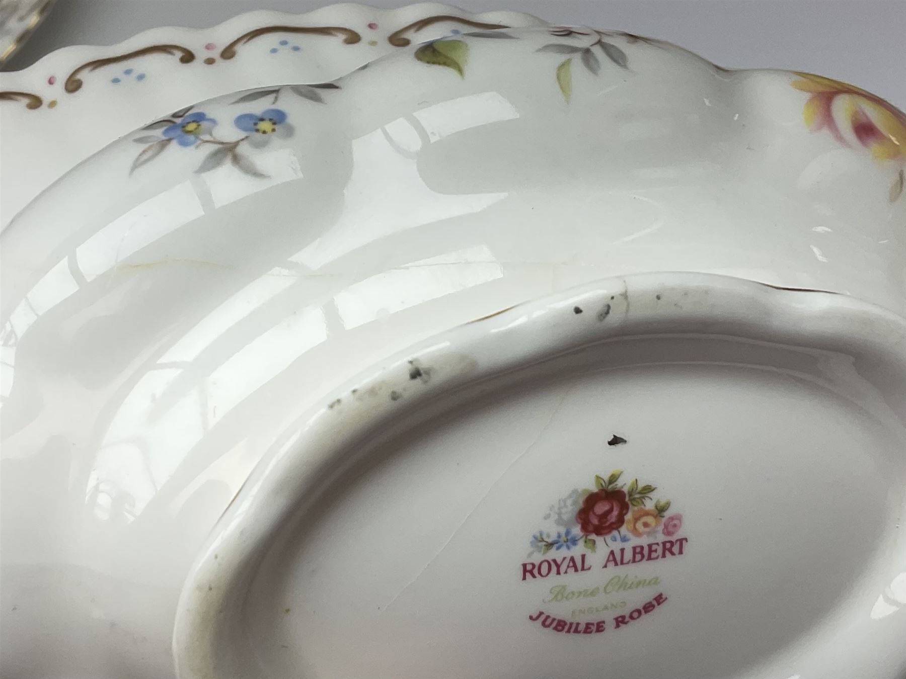 Royal Albert Old Country Roses pattern tea set, comprising teapot, coffee pot, six teacups and six saucers, five side plates, further teacup with joined saucer and side plate, open sucrier, milk jug, cake plate, and preserve pot and cover, together with Royal Albert Jubilee Rose pattern sauce boat and stand, and Royal Albert Lavender Rose pattern cake stand. 