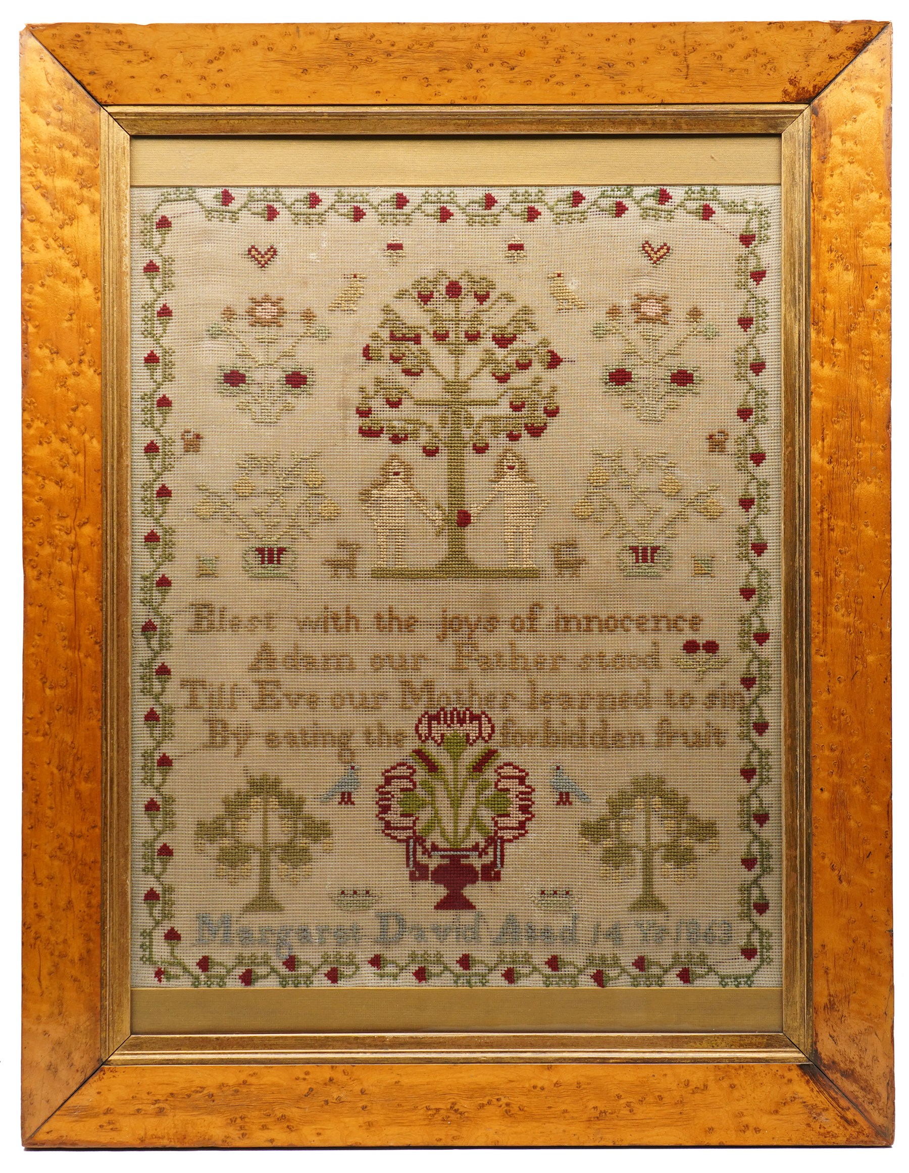 Victorian sampler, by Margaret David 1863, 'Blest with the joys of innocence, Adam our Father stood, Till Eve our Mother learned to sin, By eating the forbidden fruit', depicting Adam and Eve beneath a tree, in Birds Eye maple veneered frame, overall 90cm x 69cm 