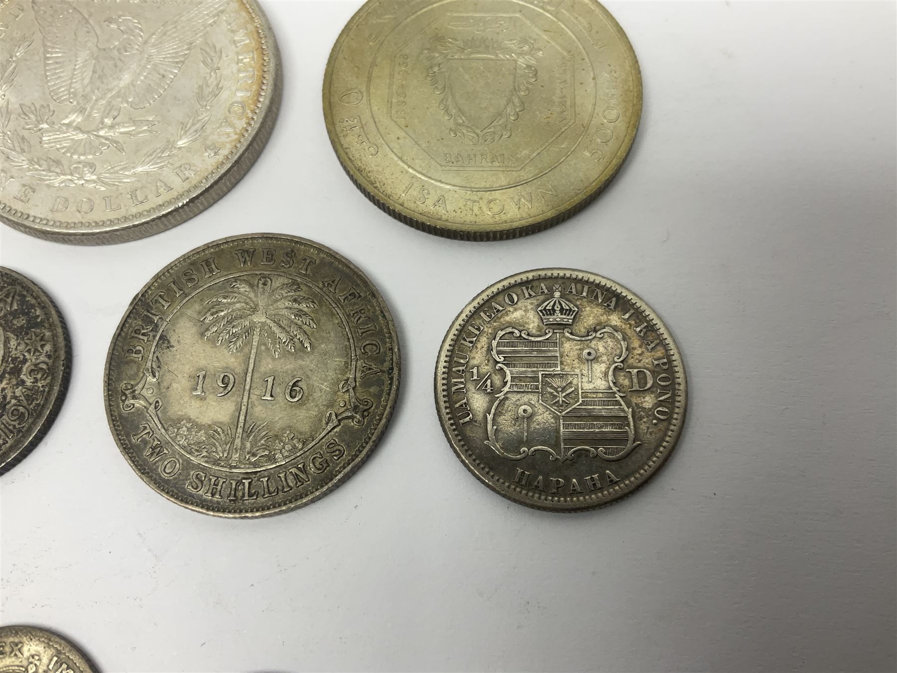 King George V British West Africa 1916 two shillings coin, King George VI Australia 1943 shilling, United States of America 1887 Morgan dollar, Bahrain 1968 500 fils silver coin, Maria Theresa restrike thaler and other coinage 
