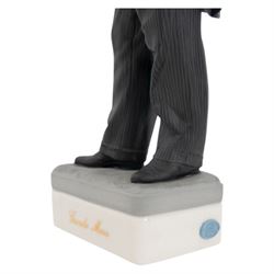 Two Spanish Algora Personajes Del Cine figures, modelled as Charlie Chaplin and Groucho Marx, with printed marks beneath, both with certificates of authenticity, H35cm
