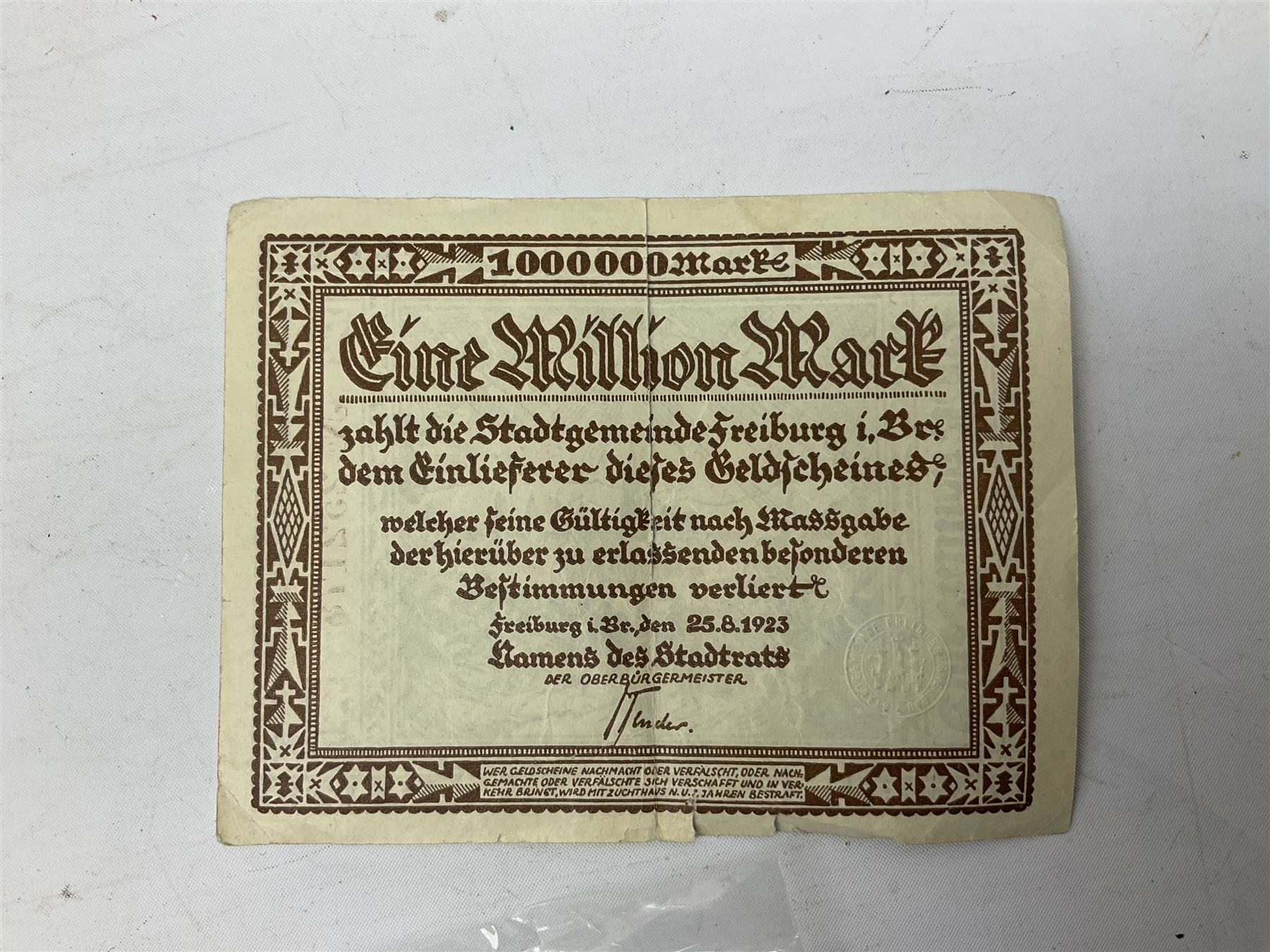 WW2 German War Pass (Wehrpass) identification paperwork for Walter Fensterseifer 2nd type booklet dated 8/6/1940, with signed photo of recipient in civilian suit. Born 31st January 1921. Numerous entries; together with quantity of small private photographs of German soldiers; One Million mark banknote 1923; 30th Corps in Germany booklet with Formation badge; and other WW2 paper ephemera