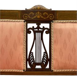 Edwardian inlaid mahogany two-seat settee or hall bench, the cresting rail inlaid with satinwood banding and boxwood stringing, central panel inlaid with scrolled leafy branches over pierced and carved lyre back, upholstered in peach fabric with repeating pattern, scrolled down sweeping arms, on square tapering supports with spade feet 
