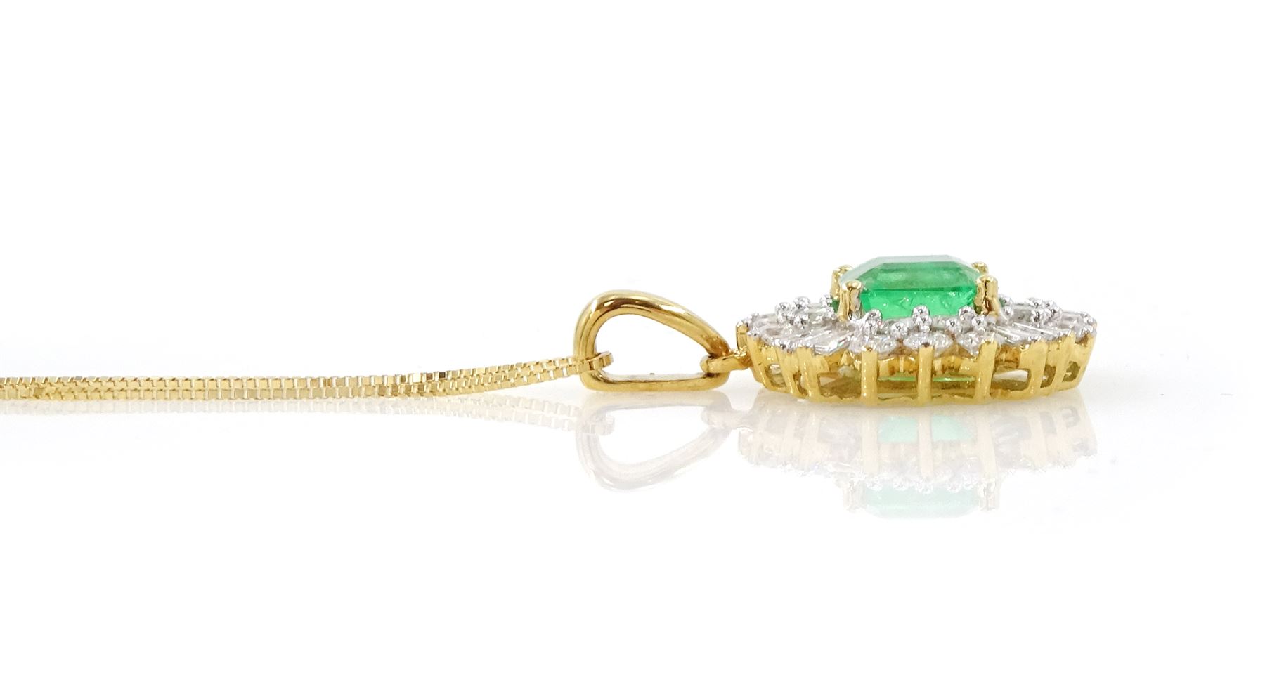 18ct gold Colombian emerald and diamond cluster pendant by Iliana, single octagonal cut emerald of 1.65 carat, surrounded by two rows of twenty round brilliant cut diamonds, spaced by eight tapered baguette cut diamonds, hallmarked, total diamond weight 0.96 carat