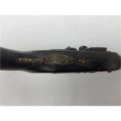 Reproduction flintlock pistol, the full walnut stock with brass filigree inlay and mounts and skull crusher butt L46cm; no visible proof marks FIREARMS CERTIFICATE REQUIRED OR RFD