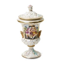Capodimonte vase and cover decorated with a raised pattern of cherubic figures H32cm, another vases and cover with panels of figures H33cm, bowl and cover with similar decoration D20cm and two other Capodimonte pieces (5)