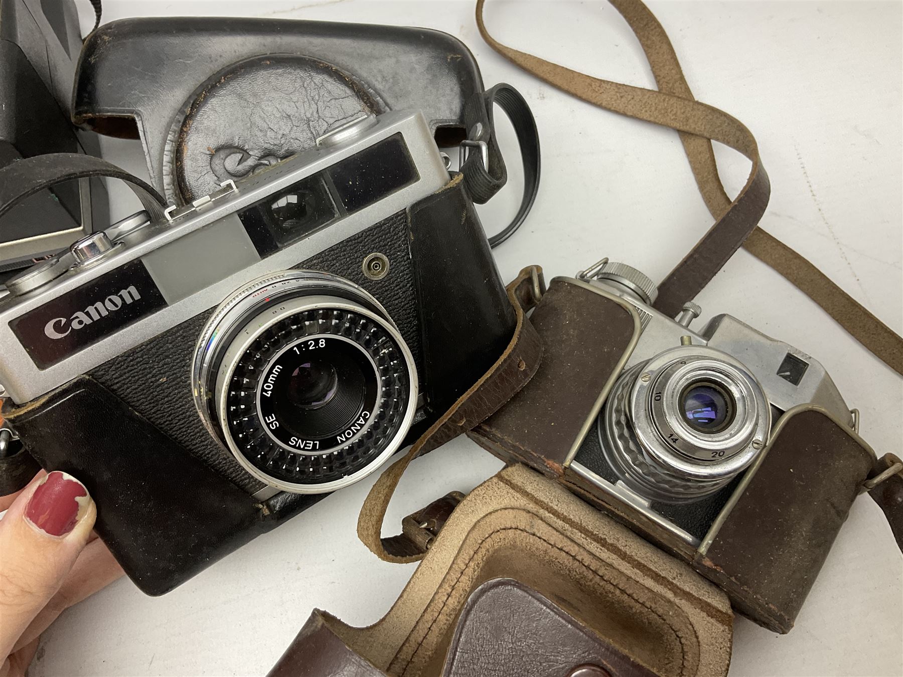 Brass telescope, together with Zenith 7 x 50 field binoculars, two polaroid cameras and other cameras and equipment 