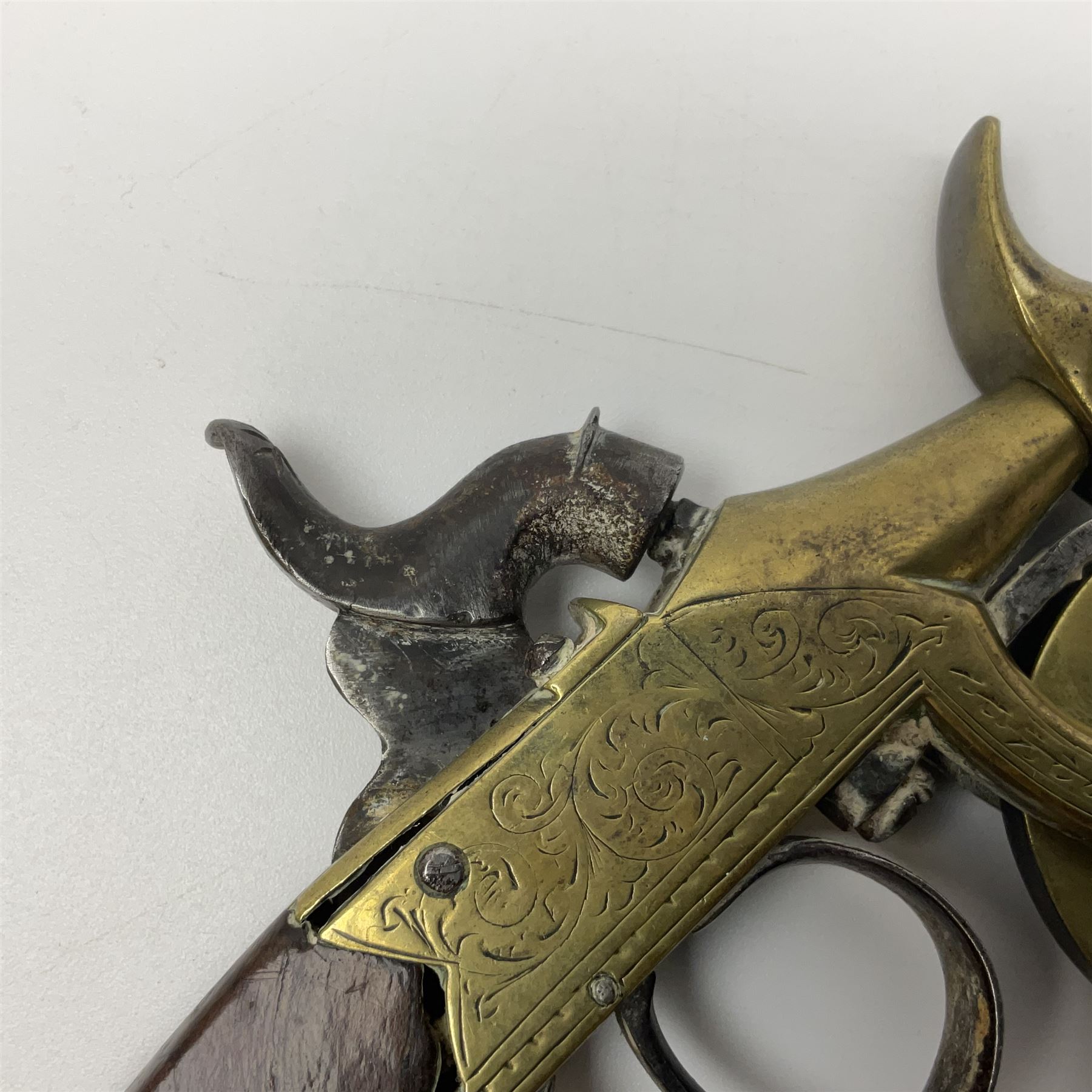 19th Century percussion eprouvette or gunpowder tester, with foliate engraved brass box lock and calibrated ratcheted wheel, steel trigger guard and walnut bag butt, L14cm
