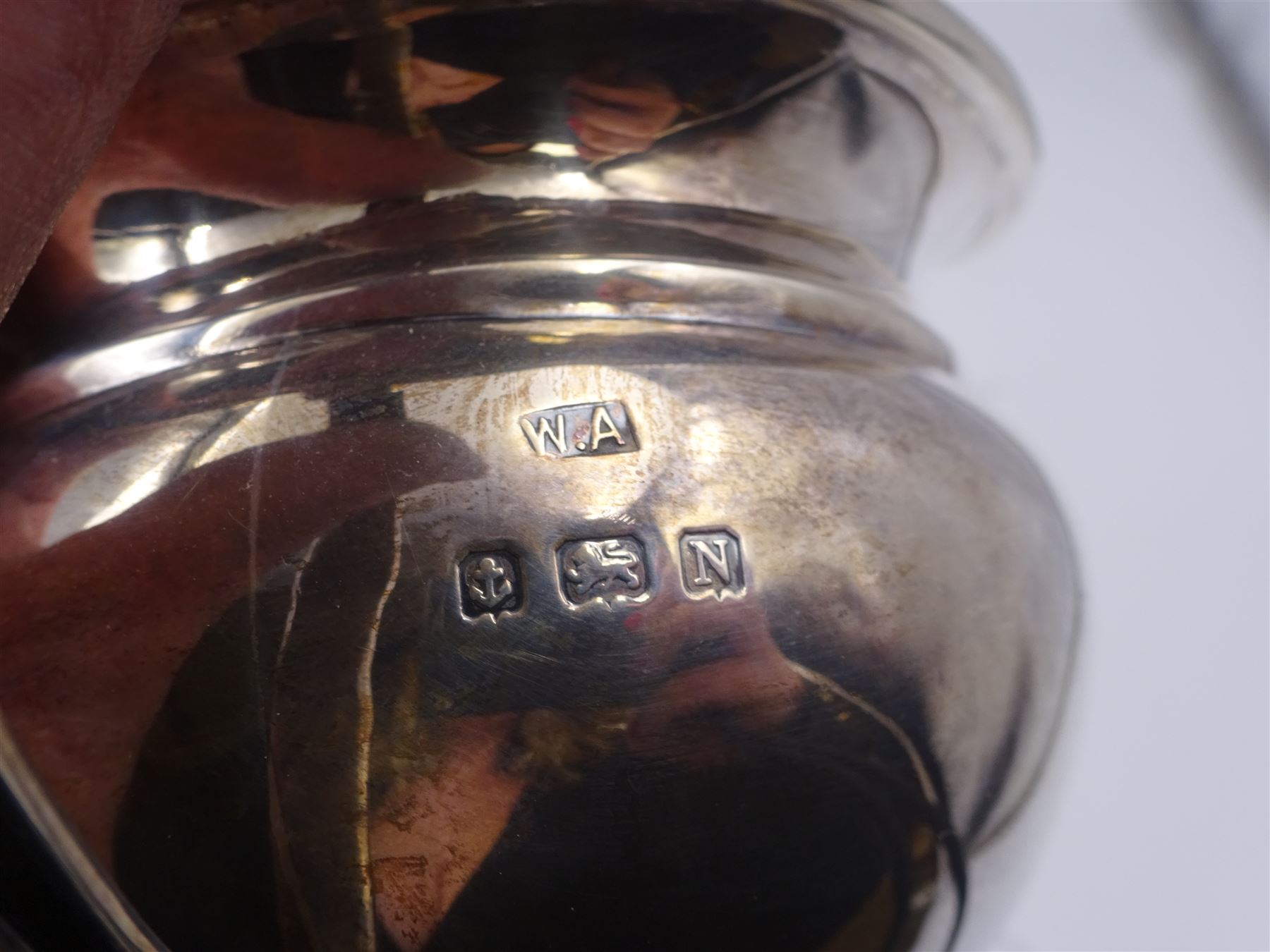 1930s three piece silver tea service, comprising teapot, milk jug and twin handled open sucrier, of oval bellied form, the teapot with Bakelite type handle and finial, hallmarked William Adams Ltd, Birmingham 1937, teapot H16cm