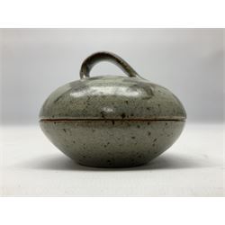 Janet Leach (American, 1918-1997) for Leach Pottery; speckled studio pottery vase of shouldered ovoid form with speckled brown decoration and trailing green and brown glaze upon beige and brown ground, with impressed J.L. monogram and Leach Pottery mark beneath, together with a Jeremy Leach blue speckled lidded circular dish with loop handle, impressed J.L, tallest H11cm
