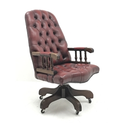 Swivel reclining desk chair upholstered in deep buttoned oxblood leather, W60cm