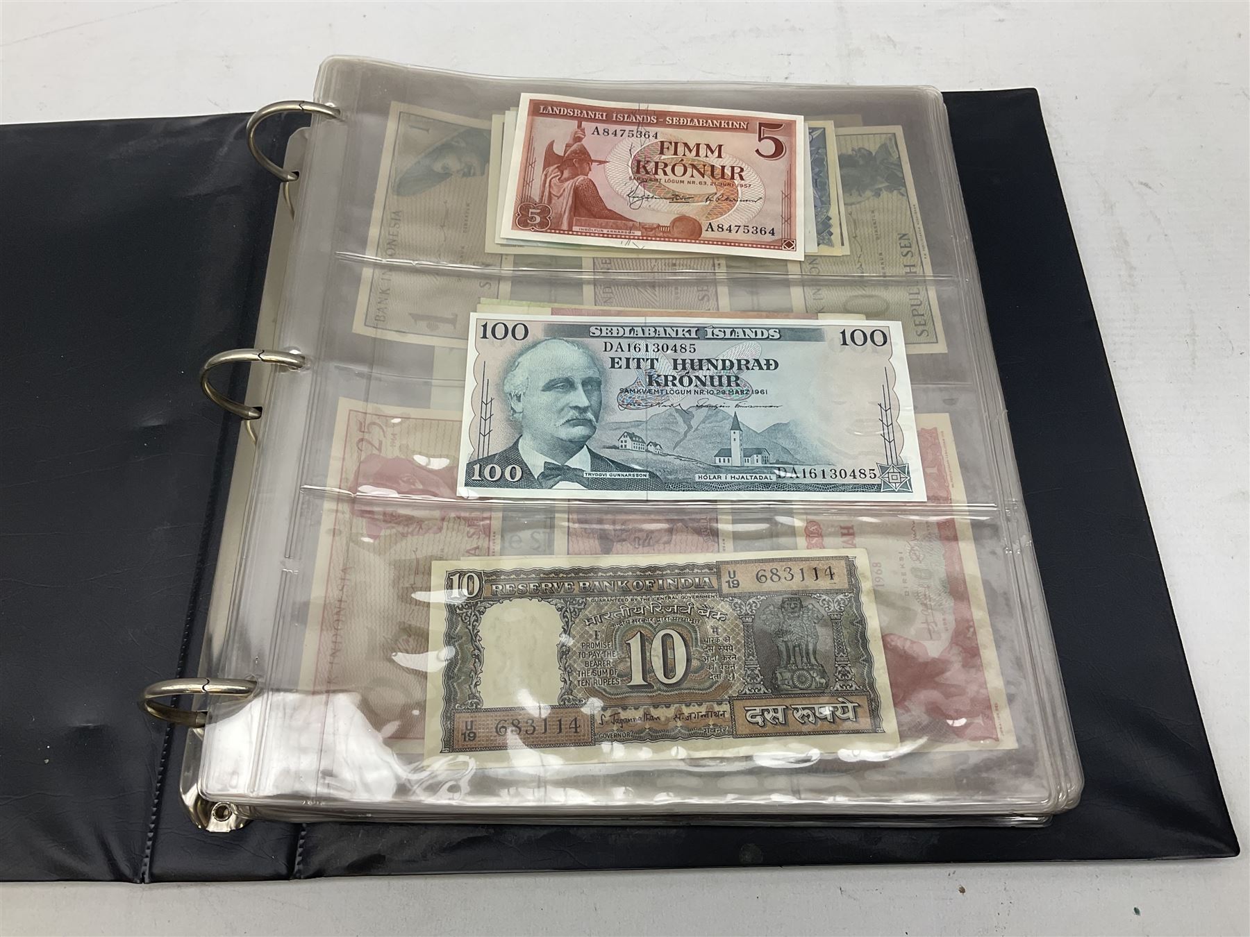 World banknotes, including Queen Elizabeth II The States of Jersey one pound 'DB202703', five pounds 'BB527762' and ten pounds 'AB651481', reserve bank of New Zealand two dollars '1L3 741894', King George V Straits Settlements one dollar 1st January 1935 'F/83 28924', various Bank of England notes etc, housed in two ring binder albums