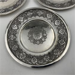 Early/mid 20th century Persian silver tea service, comprising circular serving tray, teapot, twin handled sucrier and cover, milk jug, five tea glasses with six silver holders, six tea spoons, and pair of sugar tongs, each profusely chased with foliate arabesque decoration, each bearing marks including 84 for 840 fineness, tray D40cm, teapot H16cm