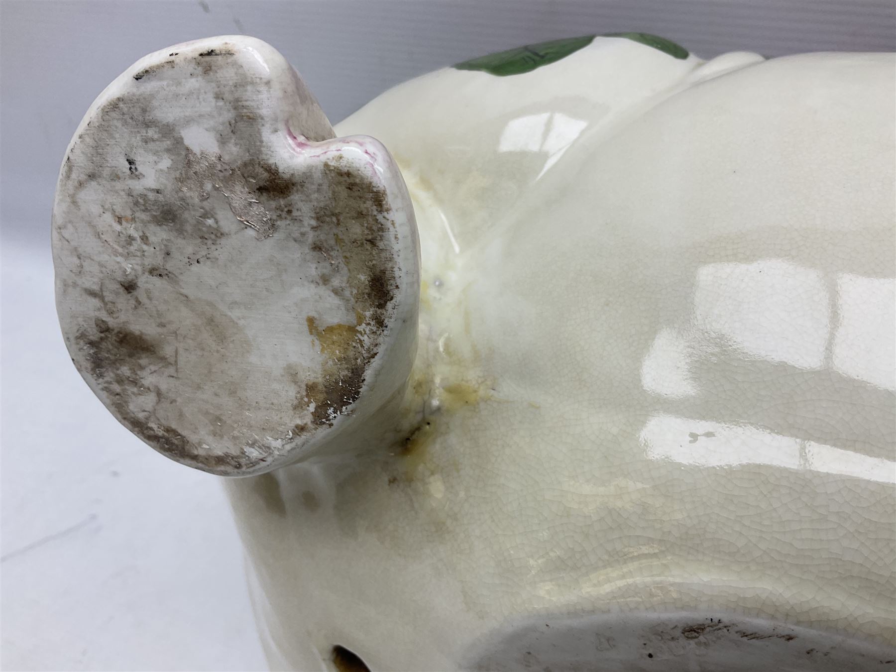 Large ceramic figure of a pig decorated with roses, L45cm