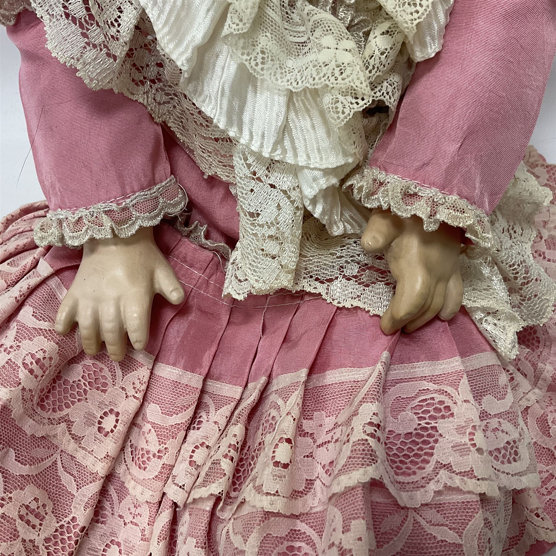 Reproduction Simon & Halbig bisque head doll with applied hair and jointed limbs; marked Simon & Halbig 117, H58cm