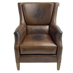 Club reading armchair, upholstered in brown Brazilian leather, studded detail, oak tapering legs