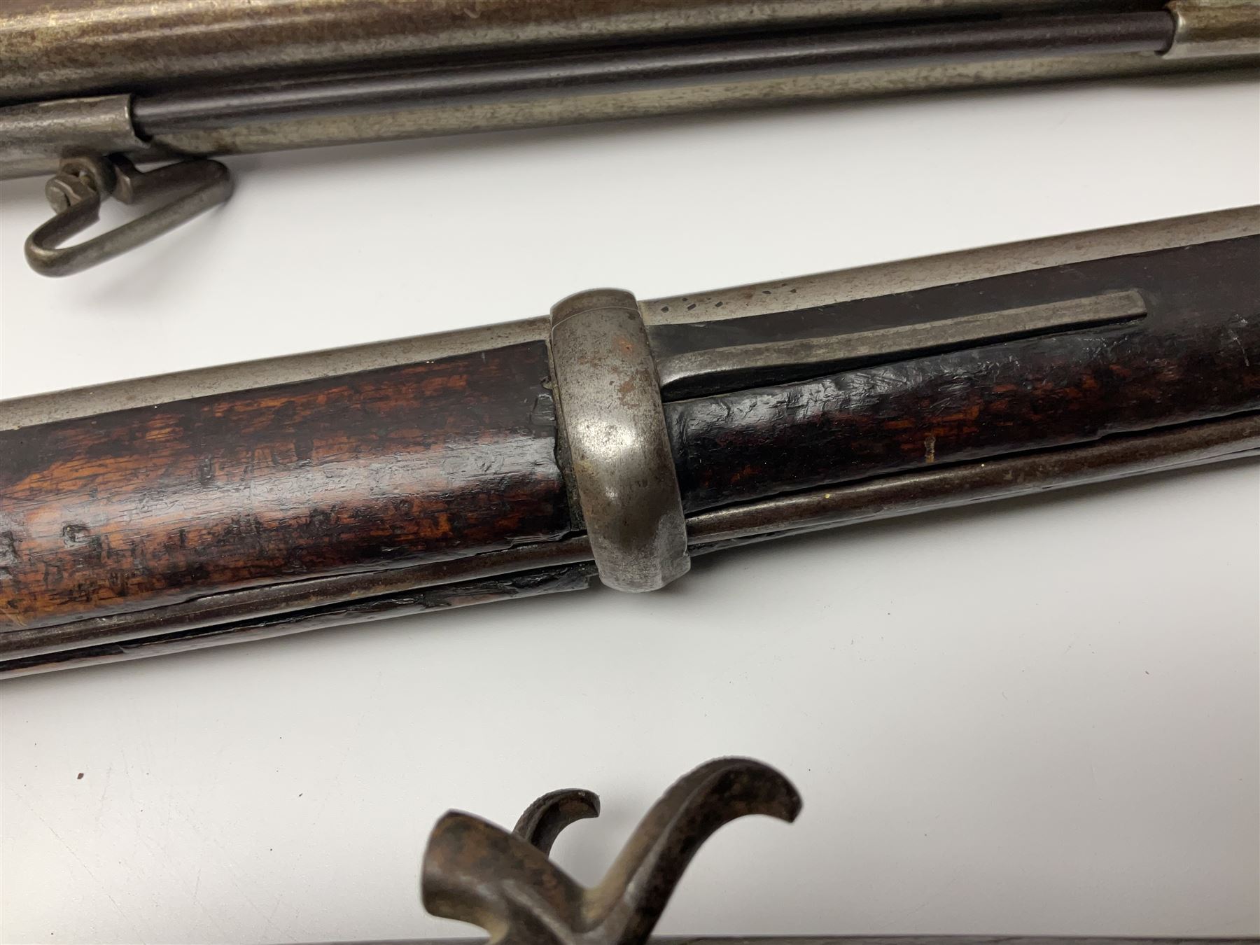 19th century Indian .577 Enfield muzzle loading rifle, proofed for 26-bore, the 98.5cm barrel with three barrel bands and later ram rod L140cm overall; 19th century Belgian side-by-side double barrel percussion shotgun, approximately 20-bore, with 74cm barrels and studded walnut stock, lock plate marked 'Liege 1868' and 'V. Gulikers-Maquinay' L117cm overall; and another side-by-side double barrel shotgun by Smythe with underlever opening (3)