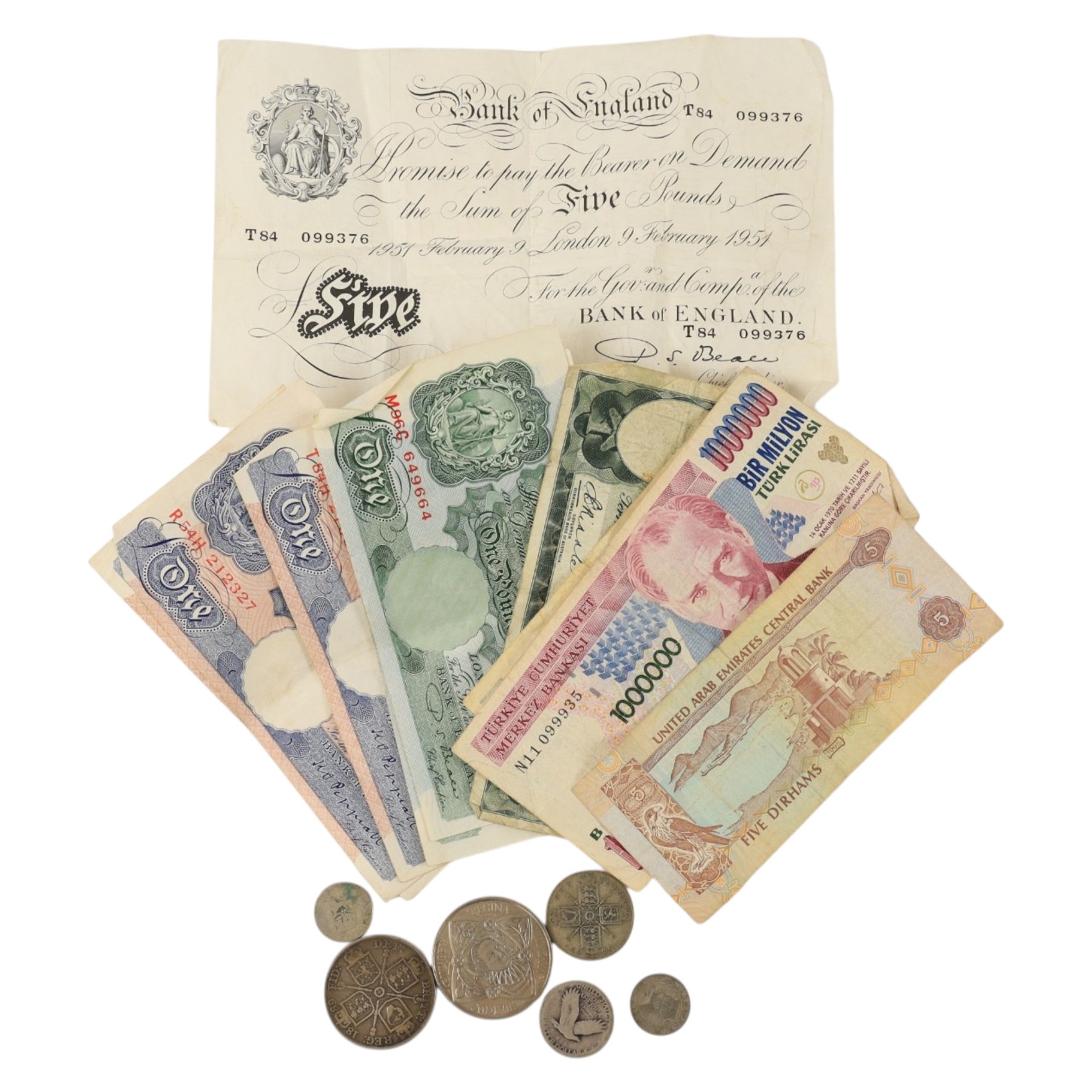 Queen Victoria 1889 silver double florin coin, four further silver coins, Queen Elizabeth II 2008 five pound coins, Bank of England Beale 1951 white five pound note, six Bank of England one pound notes, and further world banknotes
