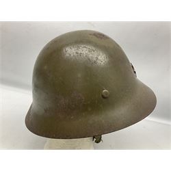 WW2 Japanese Army type 92 steel helmet with infantry star badge to centre, webbing liner and chin strap