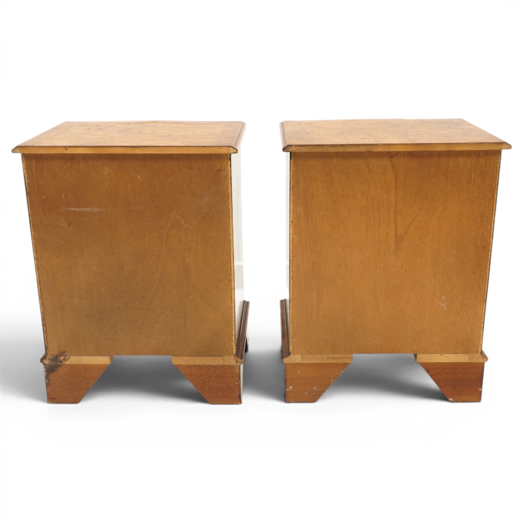 Pair of Georgian design figured elm serpentine bedside chests, moulded top raised on bracket feet