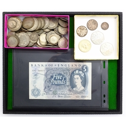  Approximately 700 grams of pre 1947 British silver, five pound banknote Fforde prefix 'R40', two 1994 fifty pence, 1986 two pounds and three small foreign silver coins  