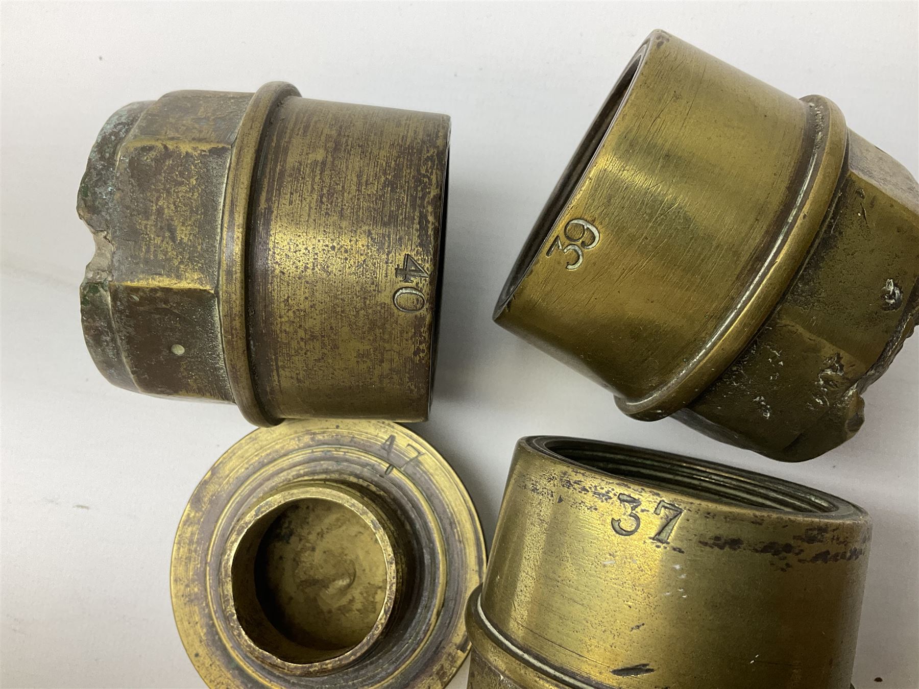 Three brass cart wheel hub caps for W. Johnson & Son Builders Hull, another for W. Harrison Builder Hull, copper printing plate for Hull & Barnsley Railway Timetable, two Hull & District Road Transport Training Group Advanced Driver car badges and framed 1952 car road task disc (8)  