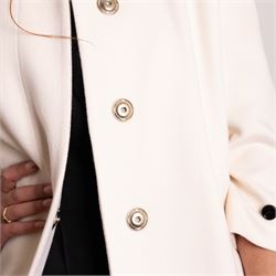Burberry London - wool coat in cream, with concealed front popper fastening, bracelet-length sleeves with tab and black button detail and side slip pockets, with slit to back, size 40, unused with original Harvey Nichols garment bag and hanger