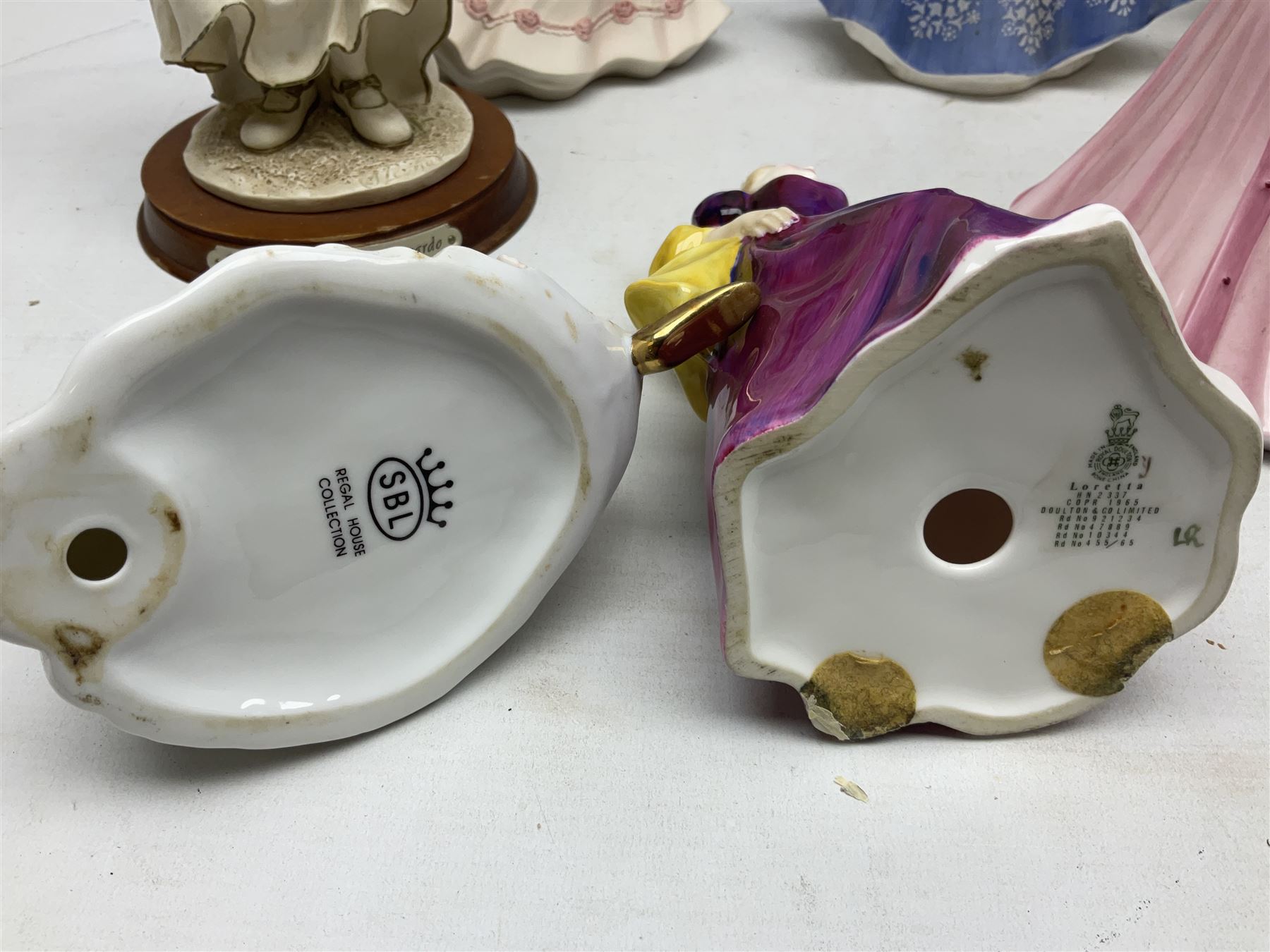 Collection of eight figures comprising Royal Doulton Loretta HN 2337 and Nina HN 2347, Coalport limited edition Emily 740/5000, Danbury Mint Jean, SBL Regal House Collection and three The Leonardo Collection examples