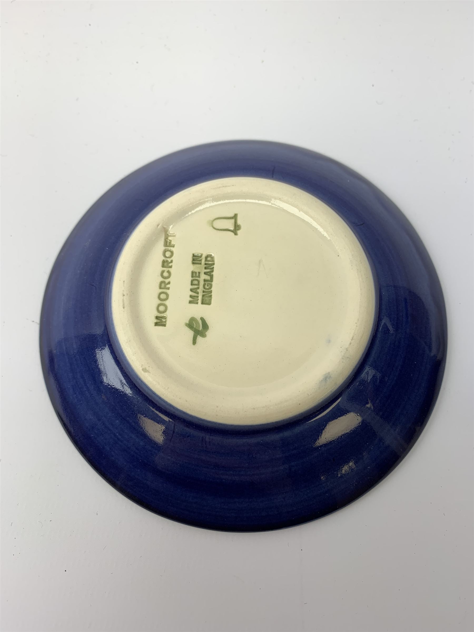 A Moorcroft pin dish and small vase, each decorated in the Anemone