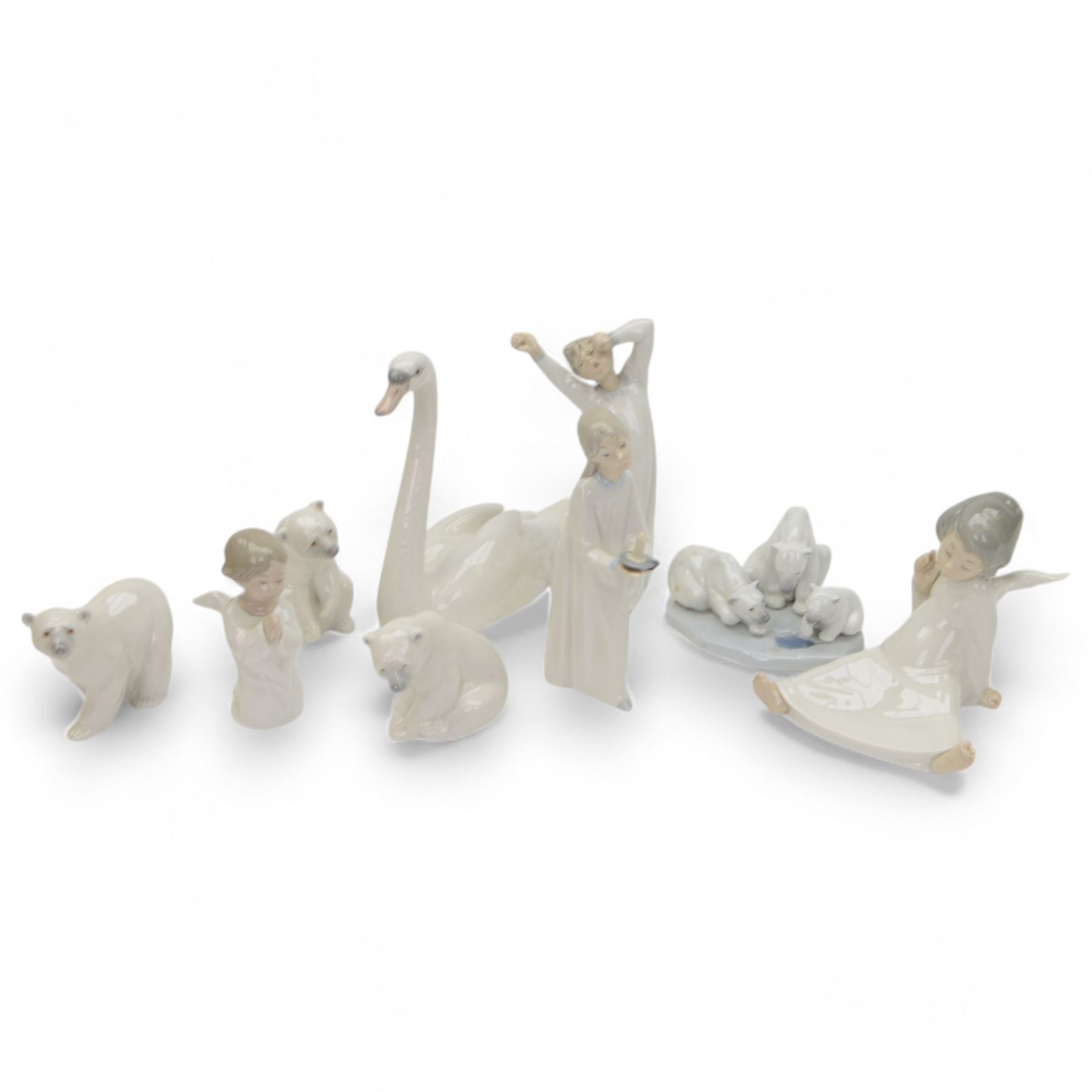 Nine Lladro figures, including  Polar Bear figure group no 1443, three polar bears, swan etc 