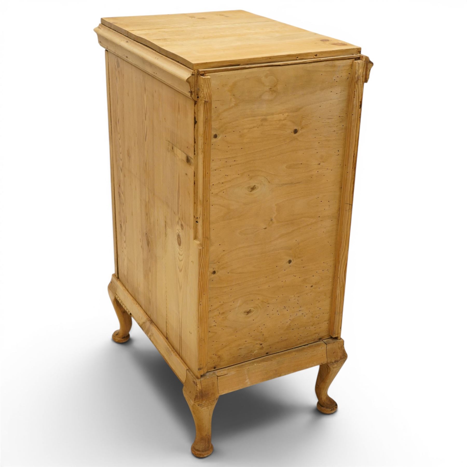 Pair of early 20th century pitch pine bedside cabinets, door with applied foliate carving, raised on cabriole legs