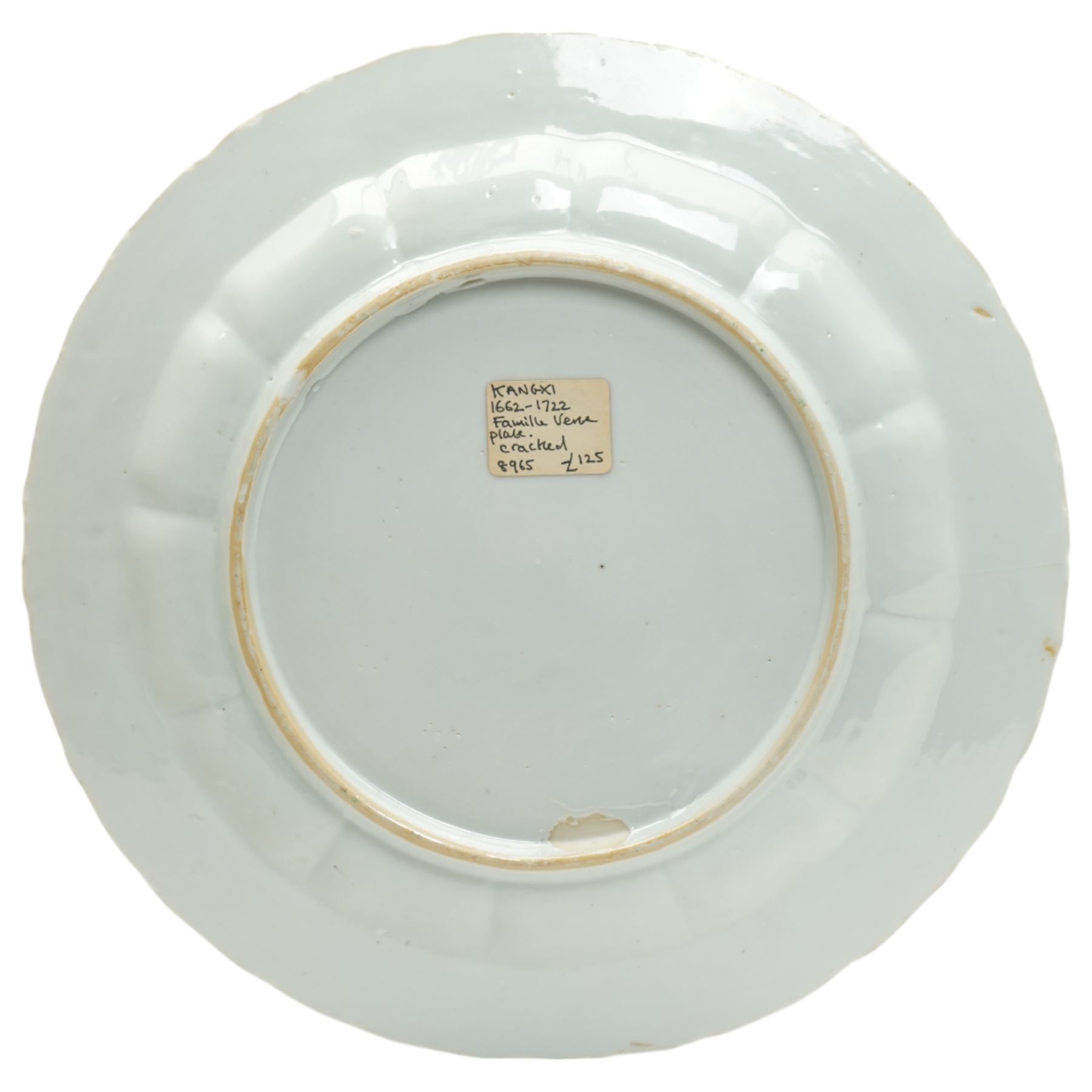 Chinese Kangxi famille verte plate, decorated with a bird perched upon a blossoming branch, within an iron red foliate border, D22cm