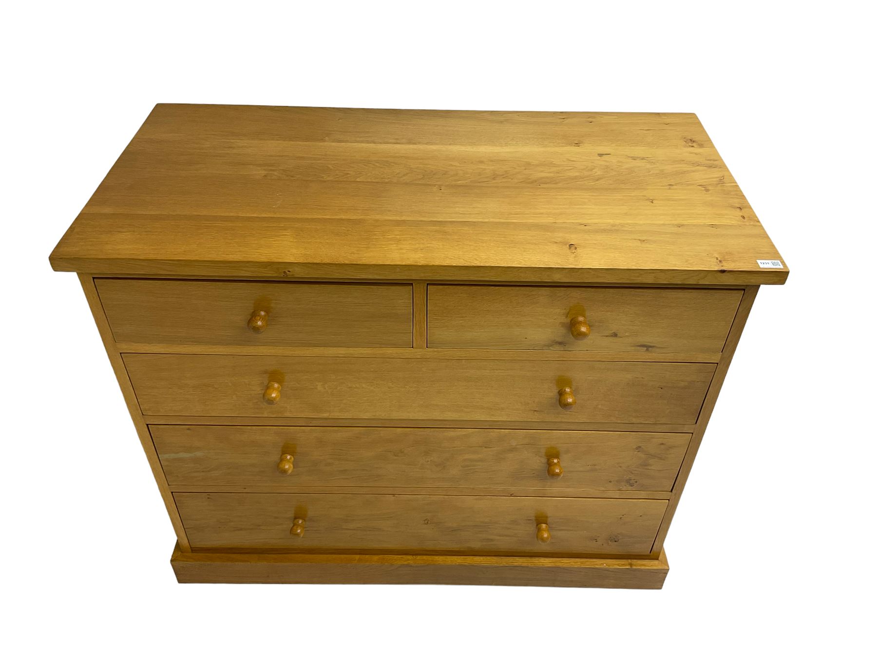 Craftsman made light oak chest, fitted with two short and three long drawers, on plinth base