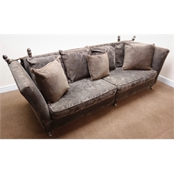  Knole drop side four seat sofa, upholstered in a purple and grey floral fabric, W255cm  